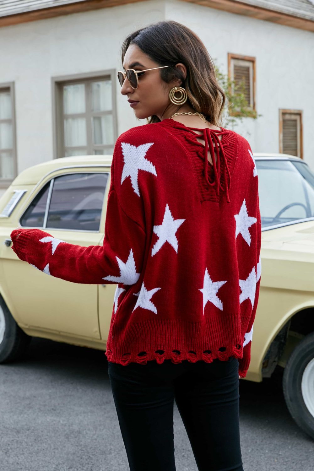 Pull à lacets et épaules tombantes à motif d'étoiles